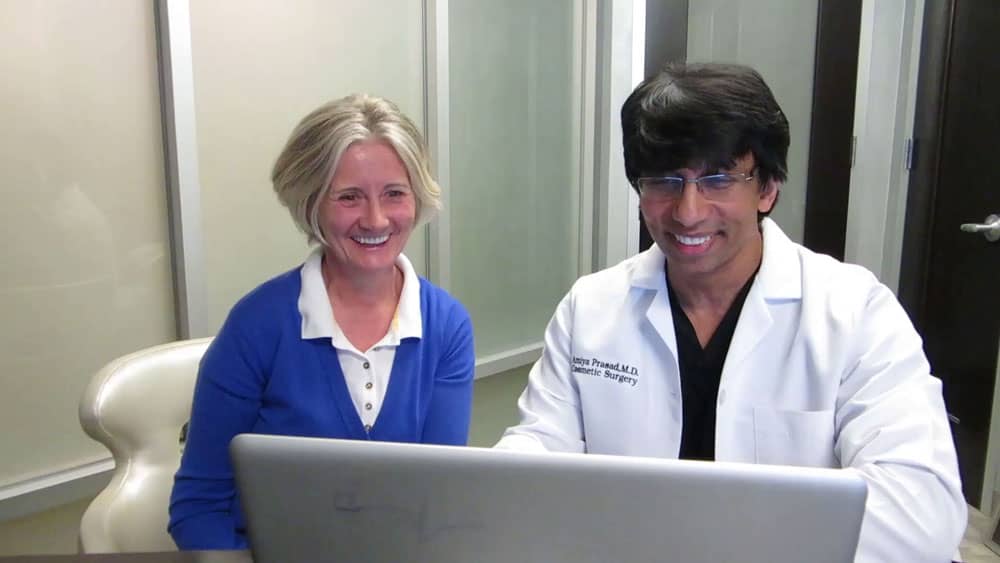 Dr. Amiya Prasad with patient during consultation