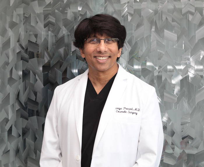 Amiya Prasad MD FACS in front of his practice