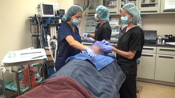 Staff attending to patient after operation